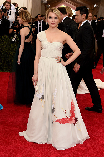 Glee Star Dianna Agron is wearing a gown, small clutch, and shoes by designer Tory Burch with Fred Leighton jewelry.